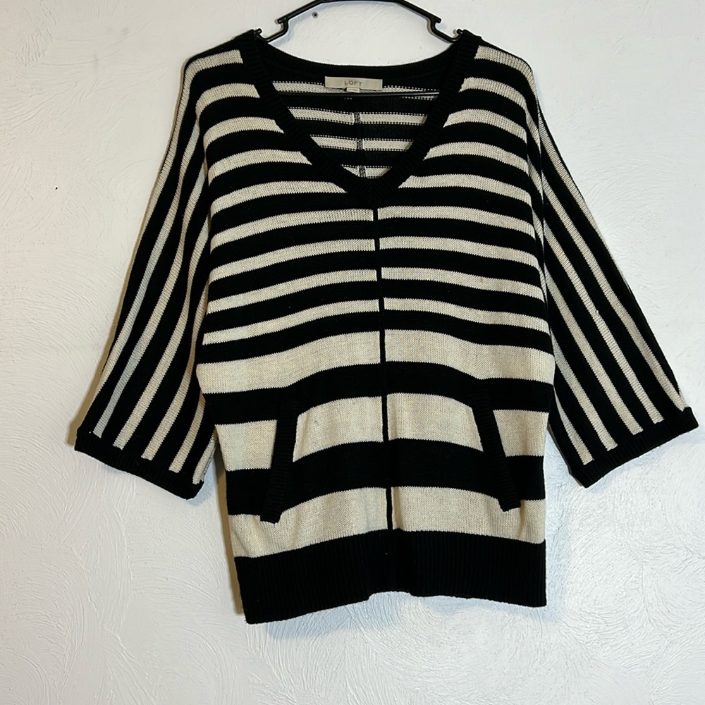 Loft sweater with hoodie style pocket